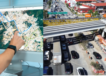 Person Points at a City Map on a Large Monitor While a Busy Construction Site and Traffic-filled Roadway Are Shown. - Nuevo León Primero