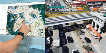 Person Points at a City Map on a Large Monitor While a Busy Construction Site and Traffic-filled Roadway Are Shown. - Nuevo León Primero