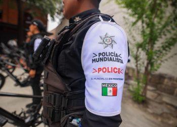 Police Officer's White Sleeve Patch Reads 'policÍa Mundialista' and 'police' with the Mexican Flag Nearby, in Tactical Gear. - Nuevo León Primero