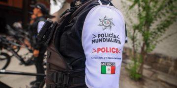 Police Officer's White Sleeve Patch Reads 'policÍa Mundialista' and 'police' with the Mexican Flag Nearby, in Tactical Gear. - Nuevo León Primero