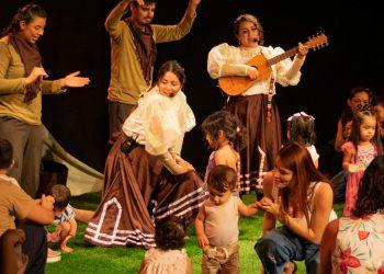 Group of Performers on a Stage with Children Dancing; a Woman Plays a Guitar As Others Guide the Kids. - Nuevo León Primero